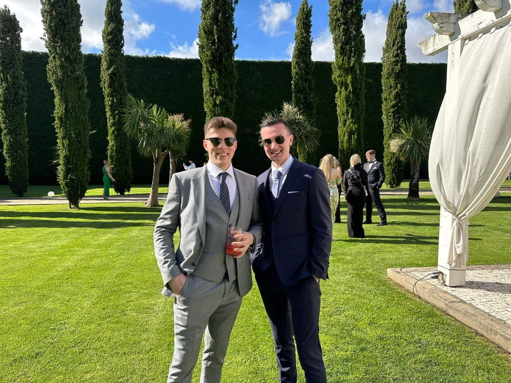 Kieran and Ethan, the co-founders of KE Property, smiling side by side in a garden
